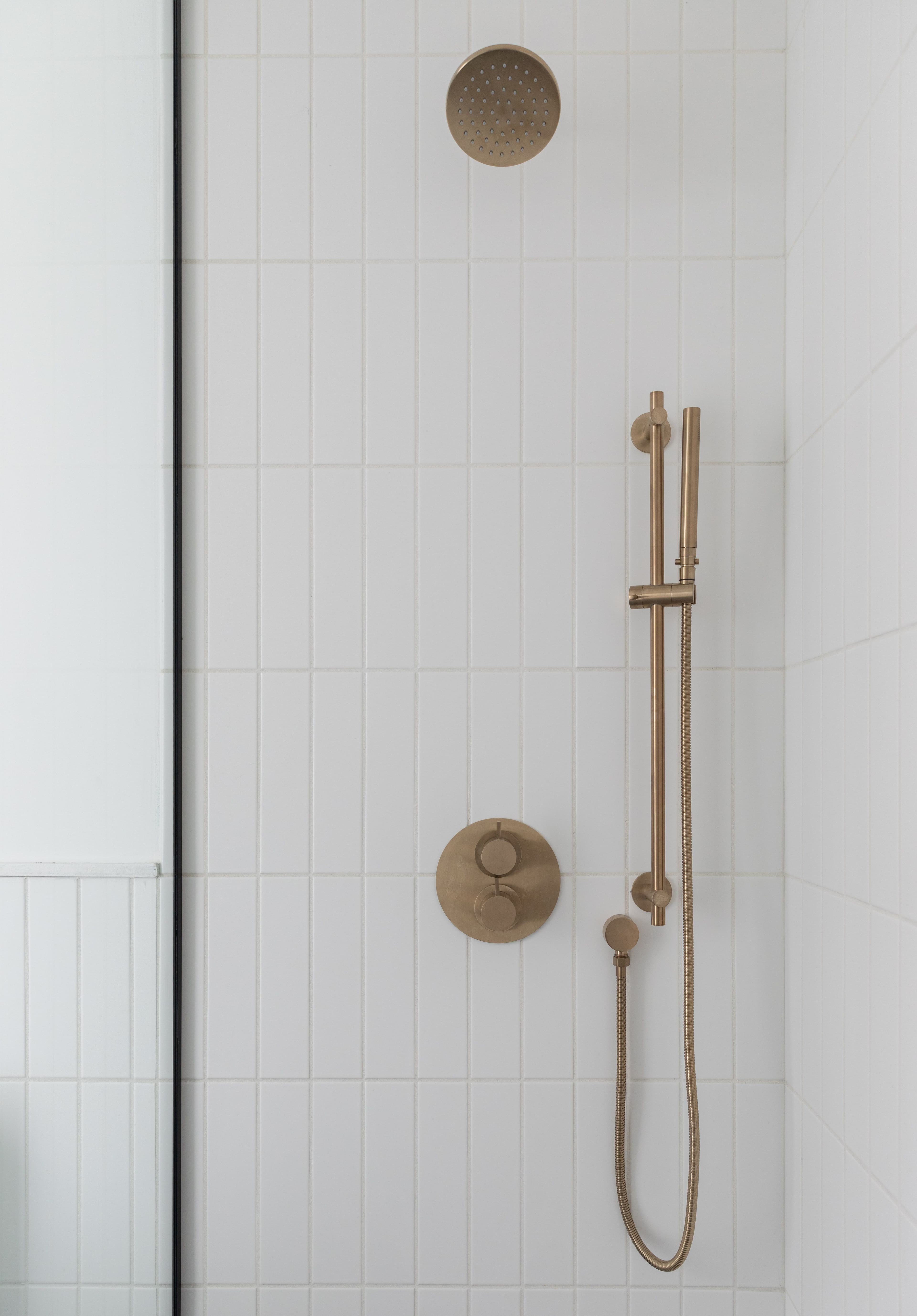 interior of shower with fixtures and glass door